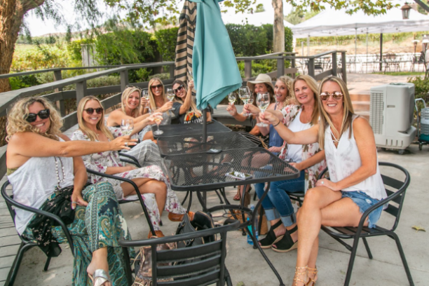 a group of people sitting on a bench